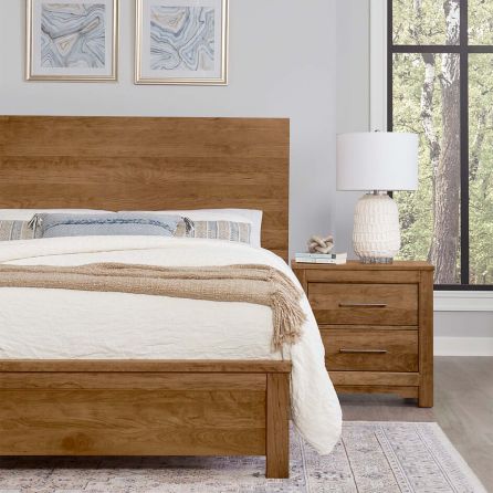 Front view of Crafted Cherry plank bed with nightstand